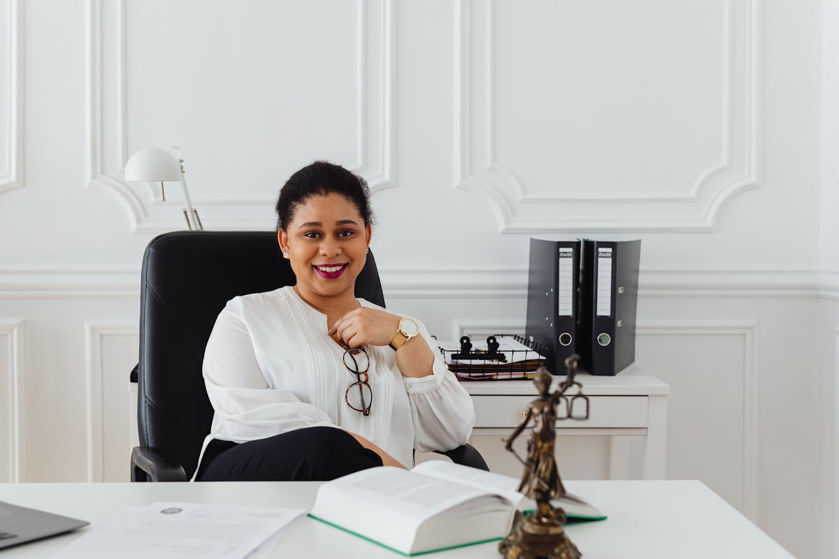 A Woman Sitting in the Office