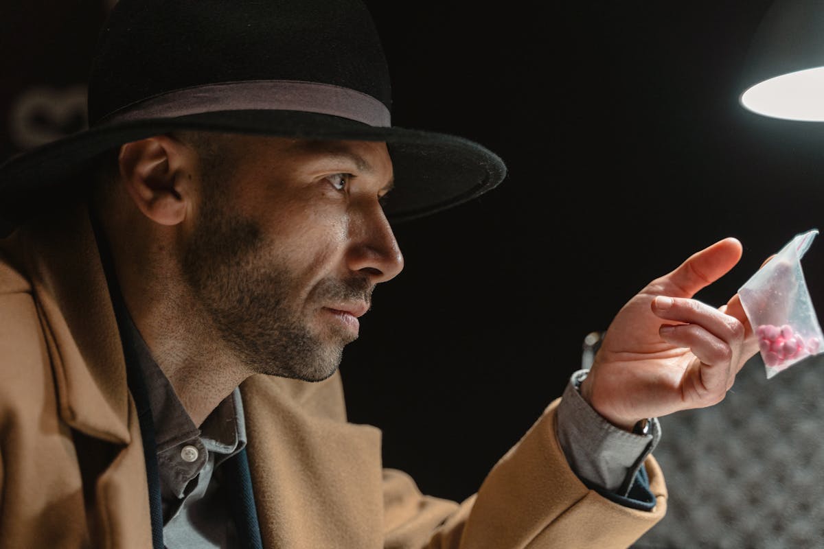 Man in Brown Coat and Black Hat