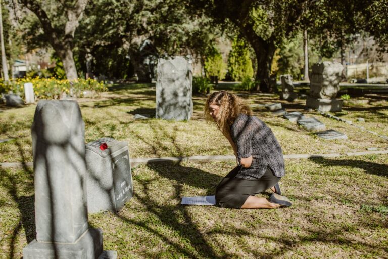 A Woman Grieving at a Cemetery