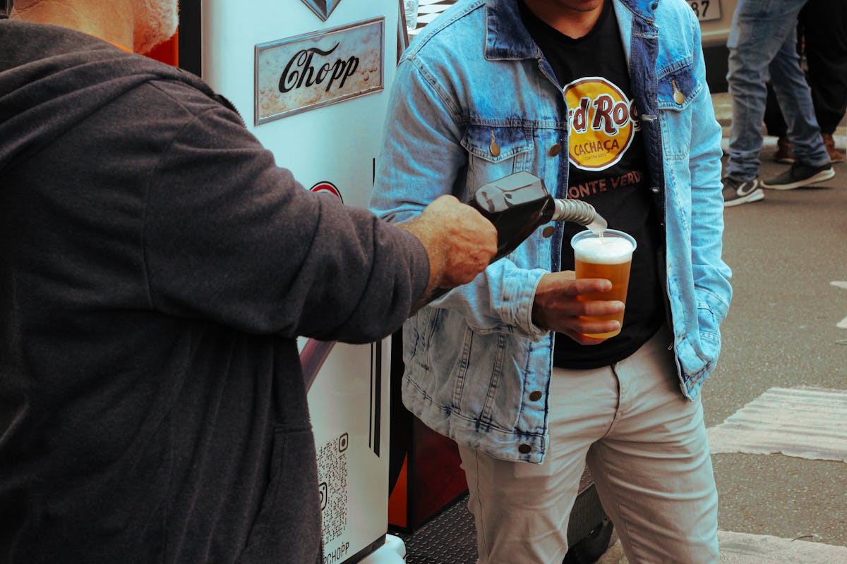 Man Pouring Beer with a Fuel Pump