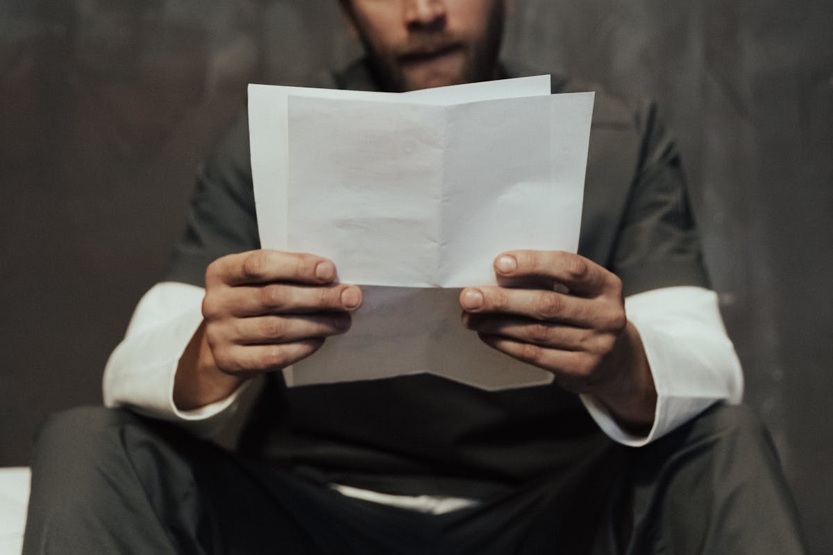 A Prisoner Reading a Letter