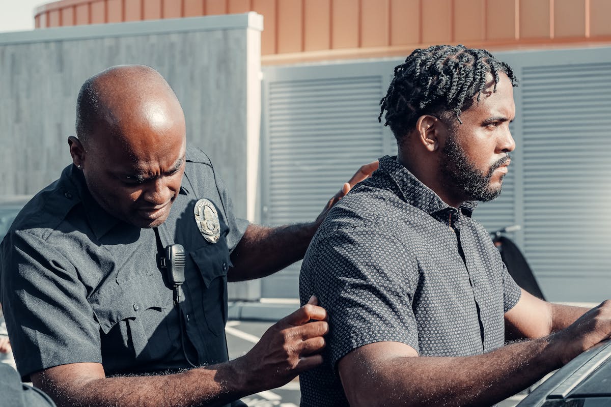 A police officer handcuffs a suspect in a dramatic arrest