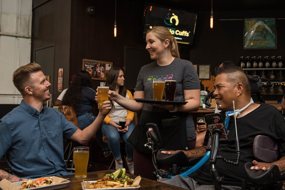 Woman Serving Beer at a Bar